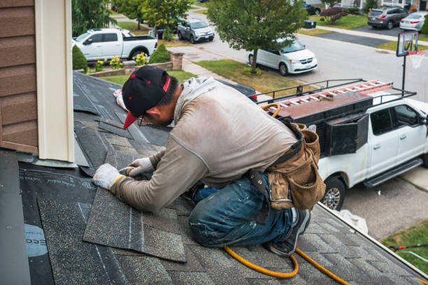Professional Storm Damage Roof Repair technician working in Mathews, VA